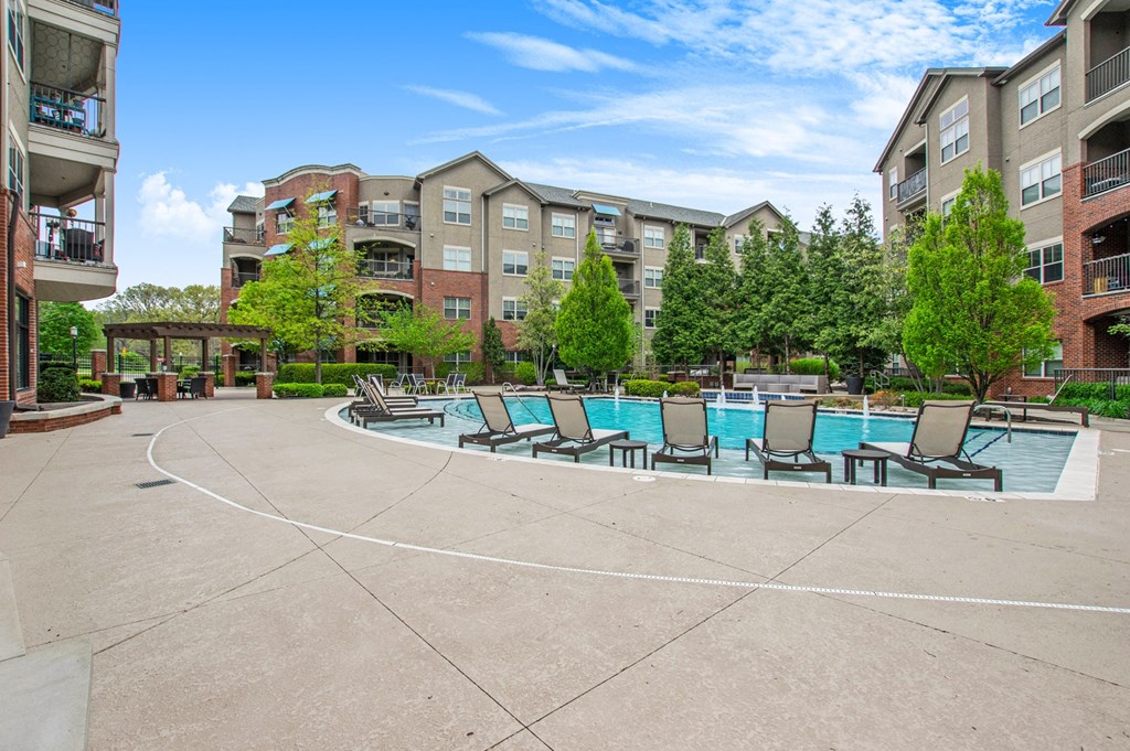 our apartments have a large pool with lounge chairs and umbrellas