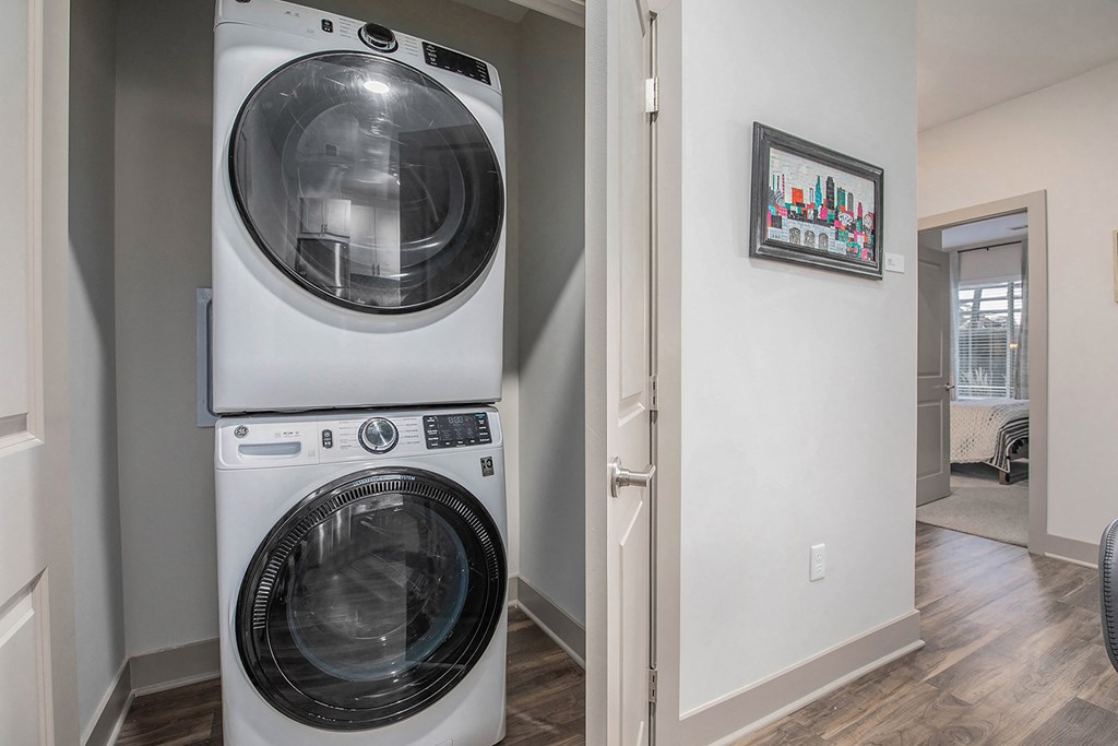 the residence apartment laundry room with washer and dryer