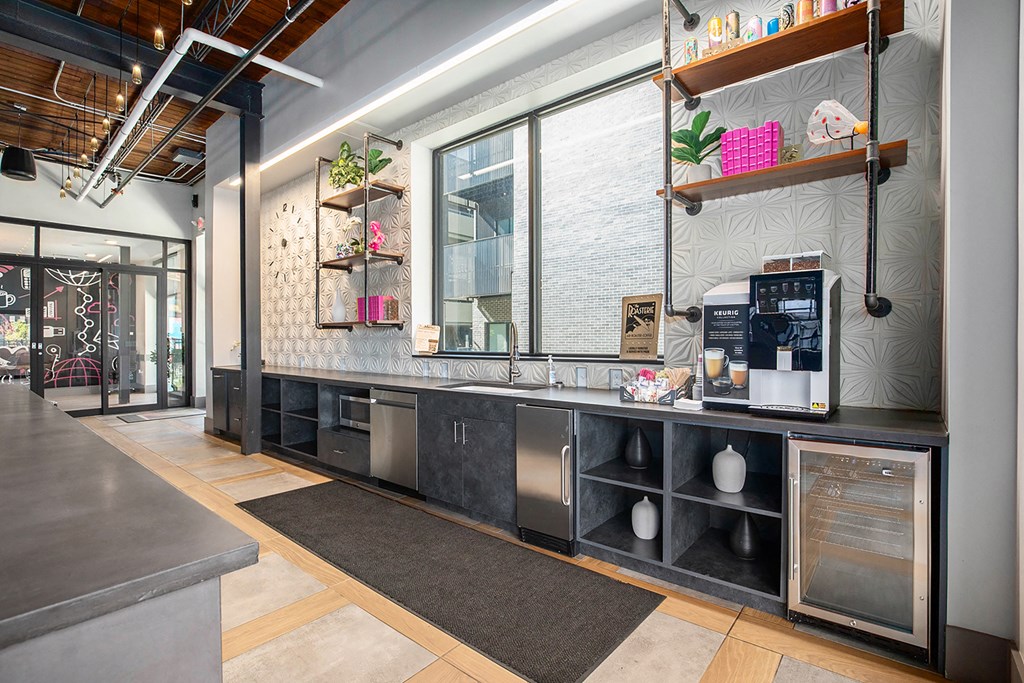 a kitchen with a counter and a large window