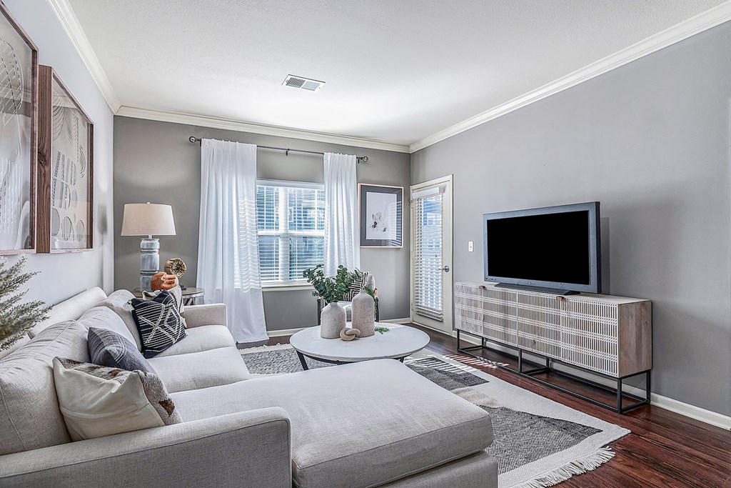 a living room with a couch and a tv