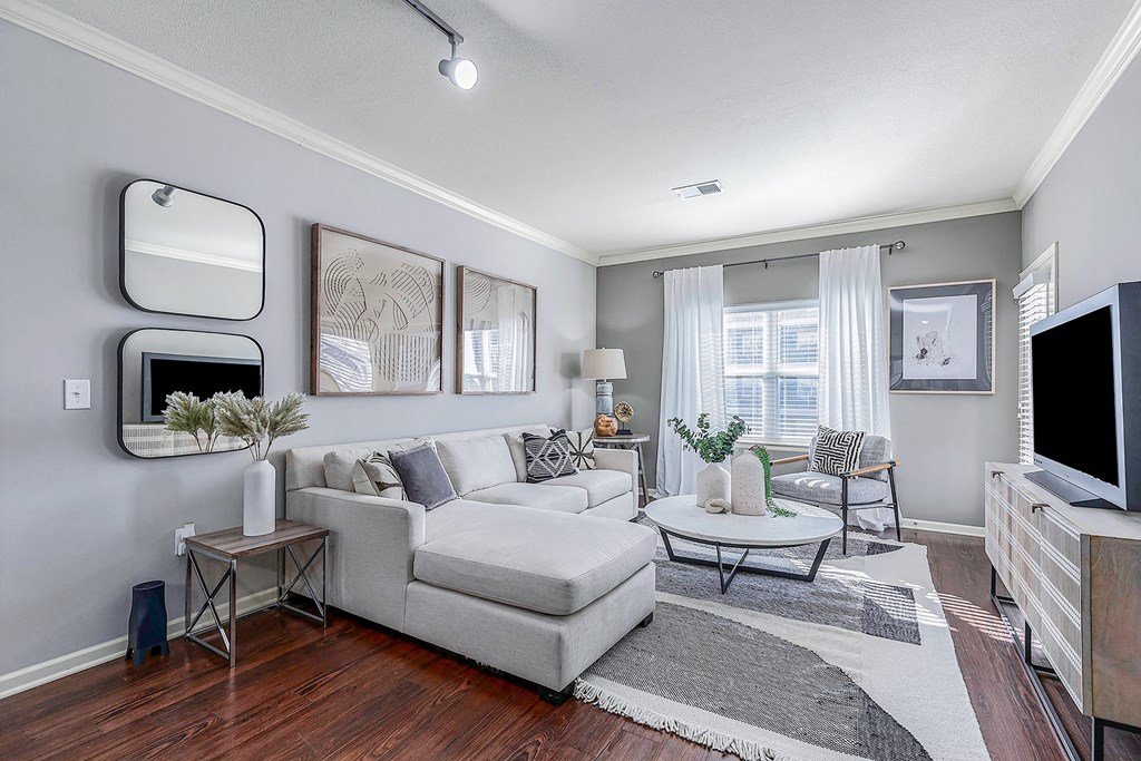 a living room with a couch and a tv