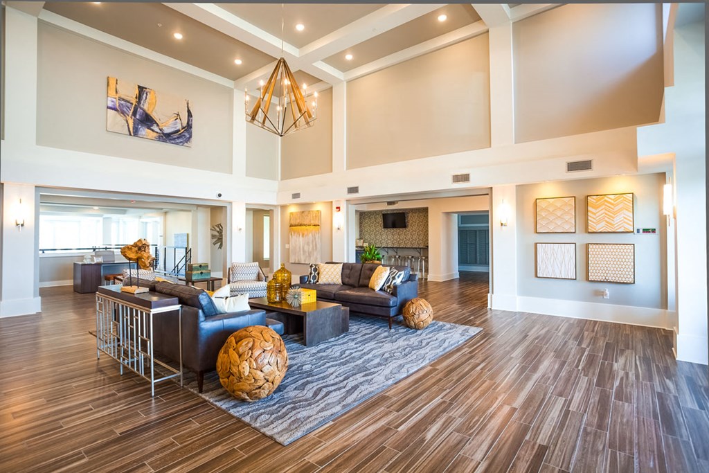 a large living room with couches and a table