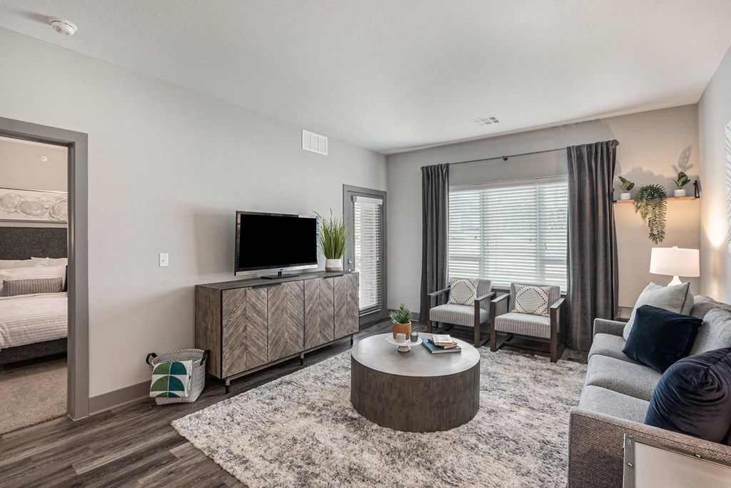 our apartments offer a living room with a couch coffee table and tv