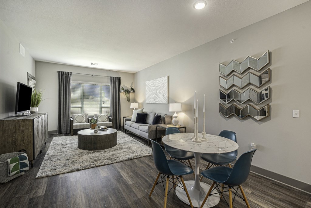 our apartments offer a living room with a couch coffee table and tv