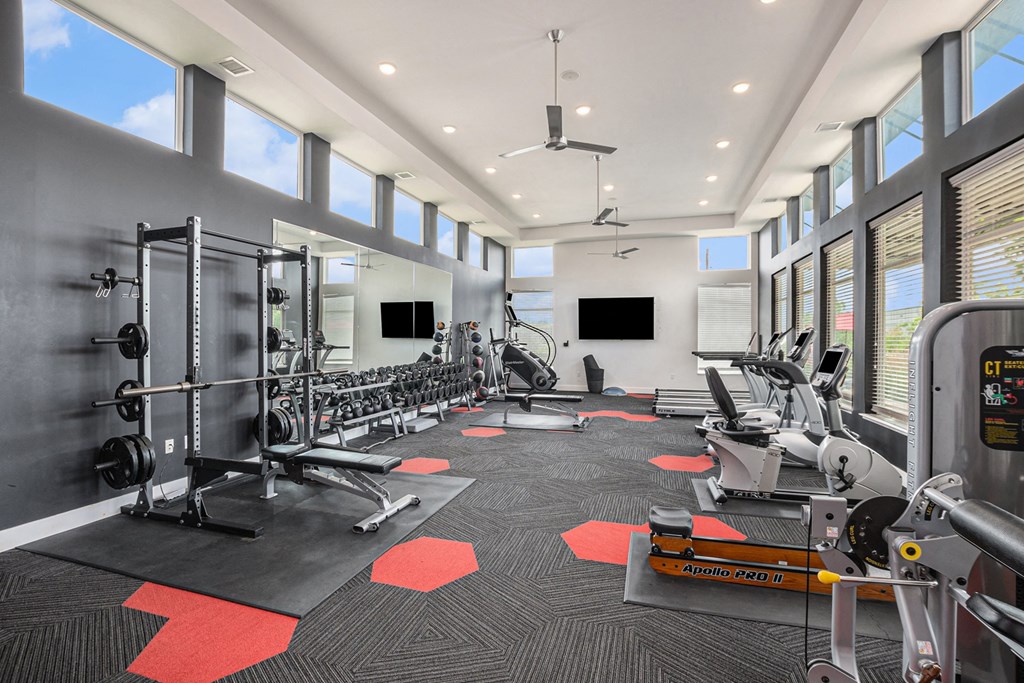 the gym at the enclave at woodbridge apartments in sugar land, tx