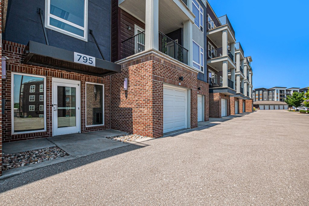 a view of a building with a white garage door