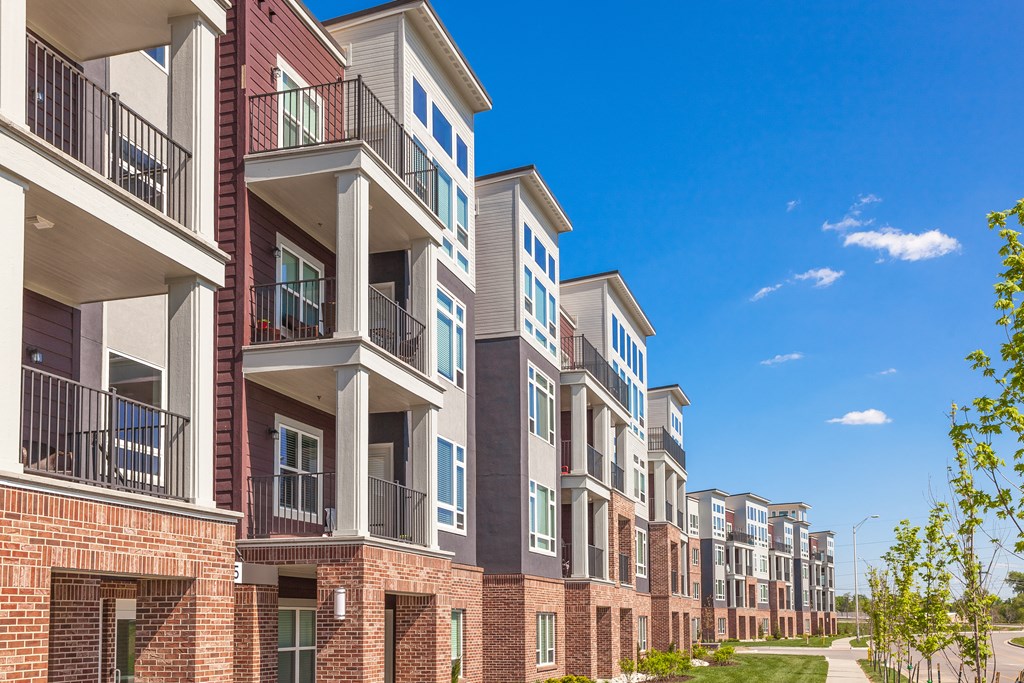 a row of apartment buildings with balconies