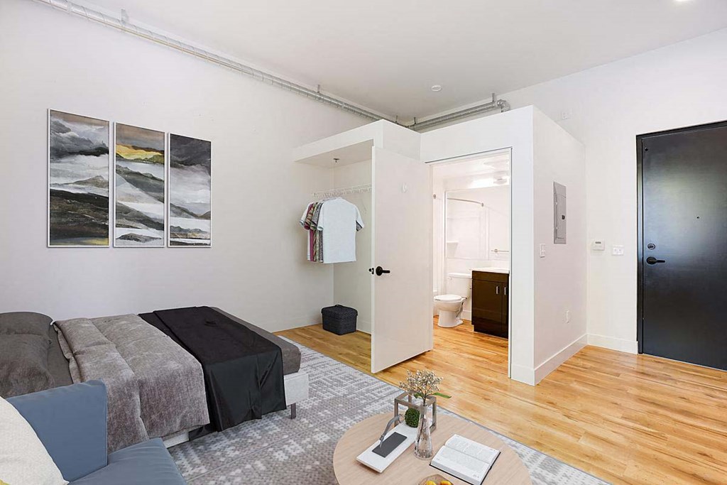 a living room with a couch and a bathroom