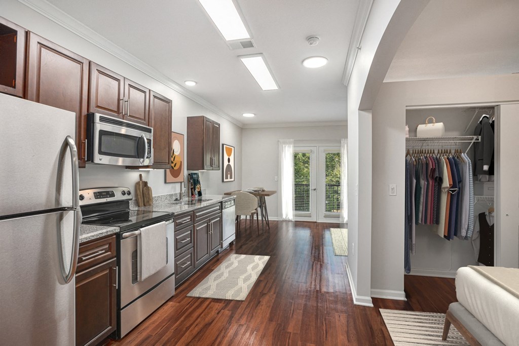 a kitchen and living room in a 555 waverly unit