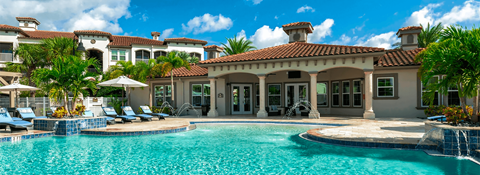 a large swimming pool in front of a house