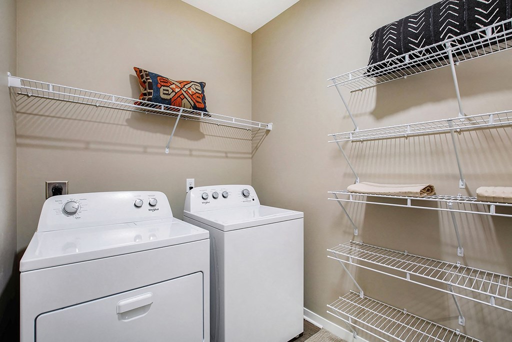 full size washer and dryer in the laundry room of an apartment