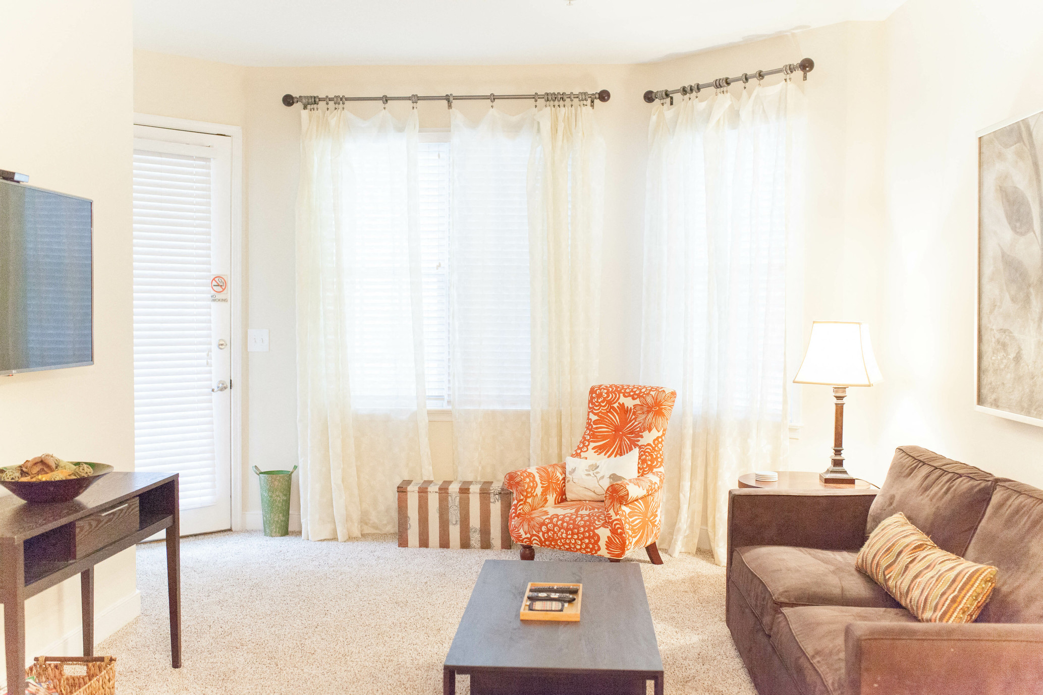 a living room with a couch and a chair