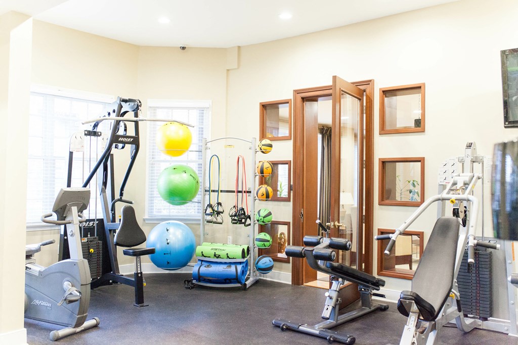 a gym with weights and other exercise equipment in a home