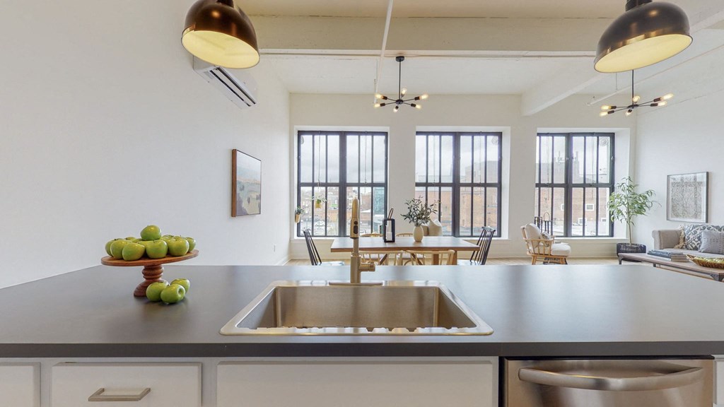 the kitchen is open to the living room and dining room