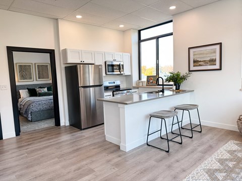 a kitchen with a counter top and a refrigerator