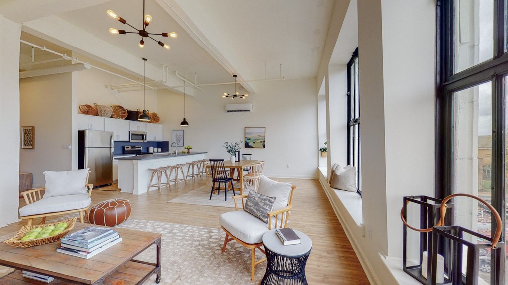 a living room with a kitchen and a dining room