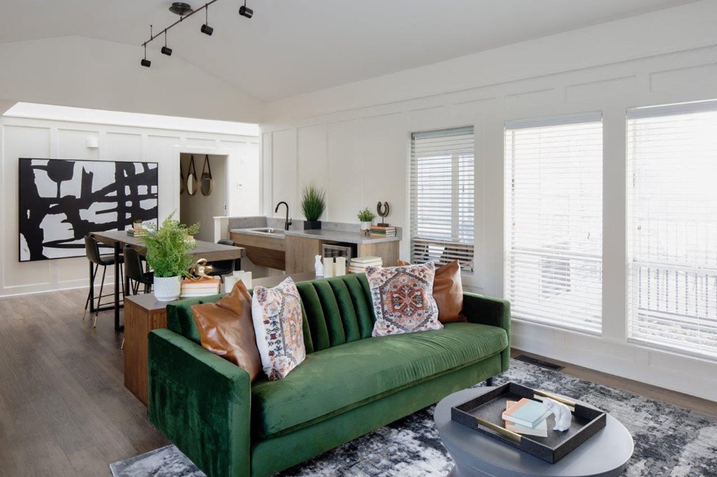 Aspire Columbia Ridge Apartments Clubhouse Seating with Couch and Kitchen