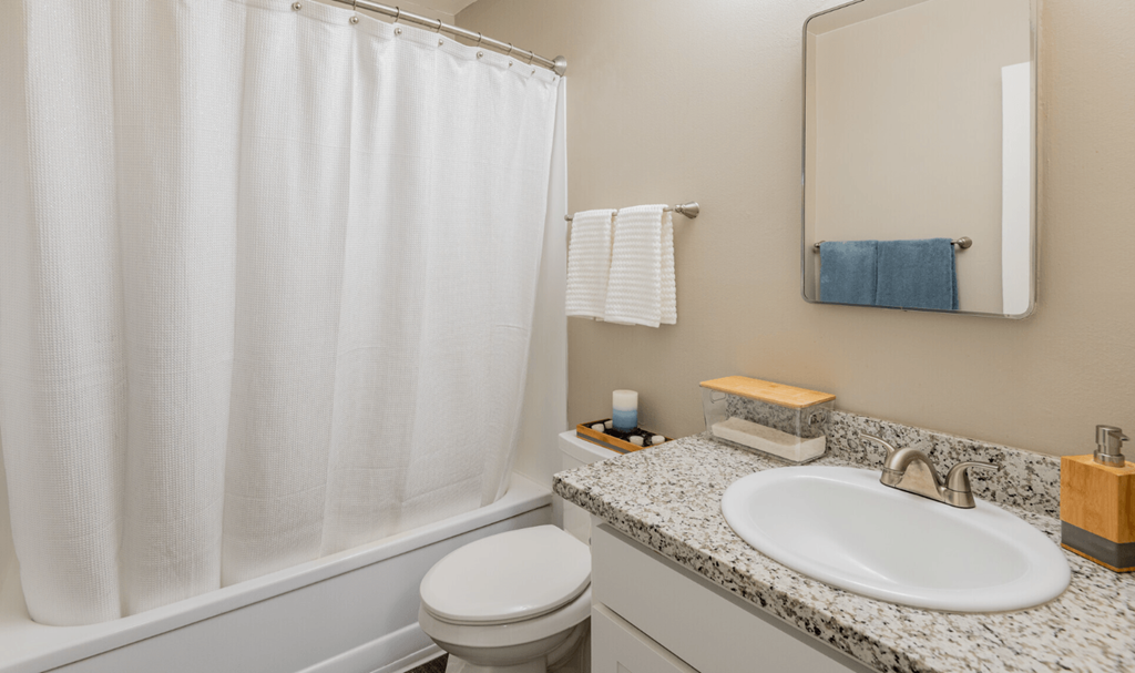a bathroom with a sink and a toilet and a shower at Aspire Sacramento Apartments, Sacramento, 95825