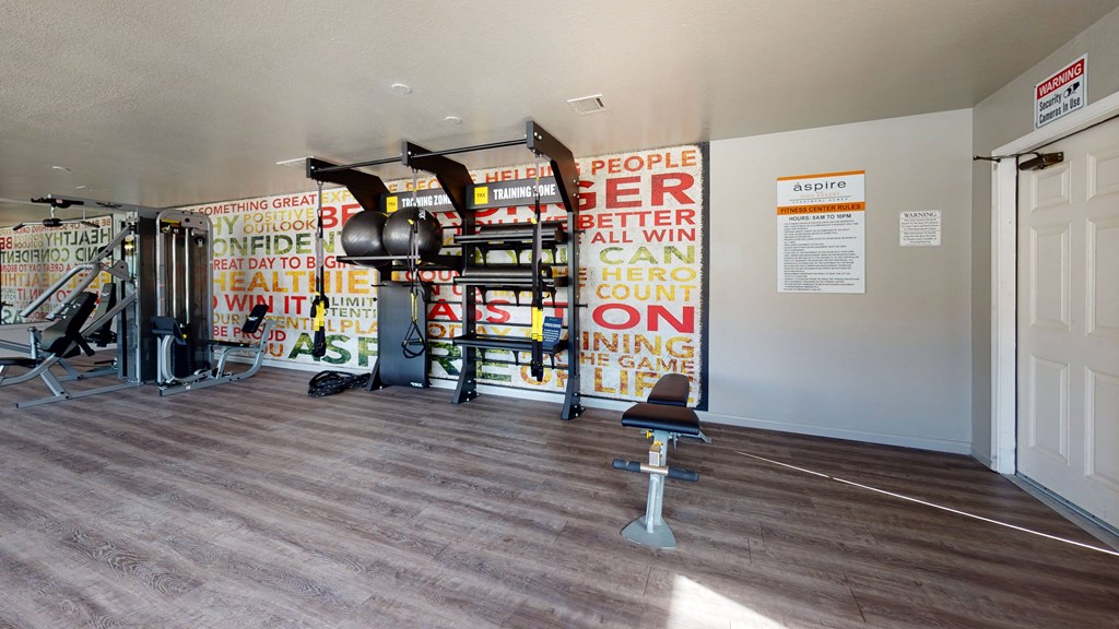 Fitness Center with All in One Training Station and Weight Machine at Aspire High Desert Apartments, Victorville, CA