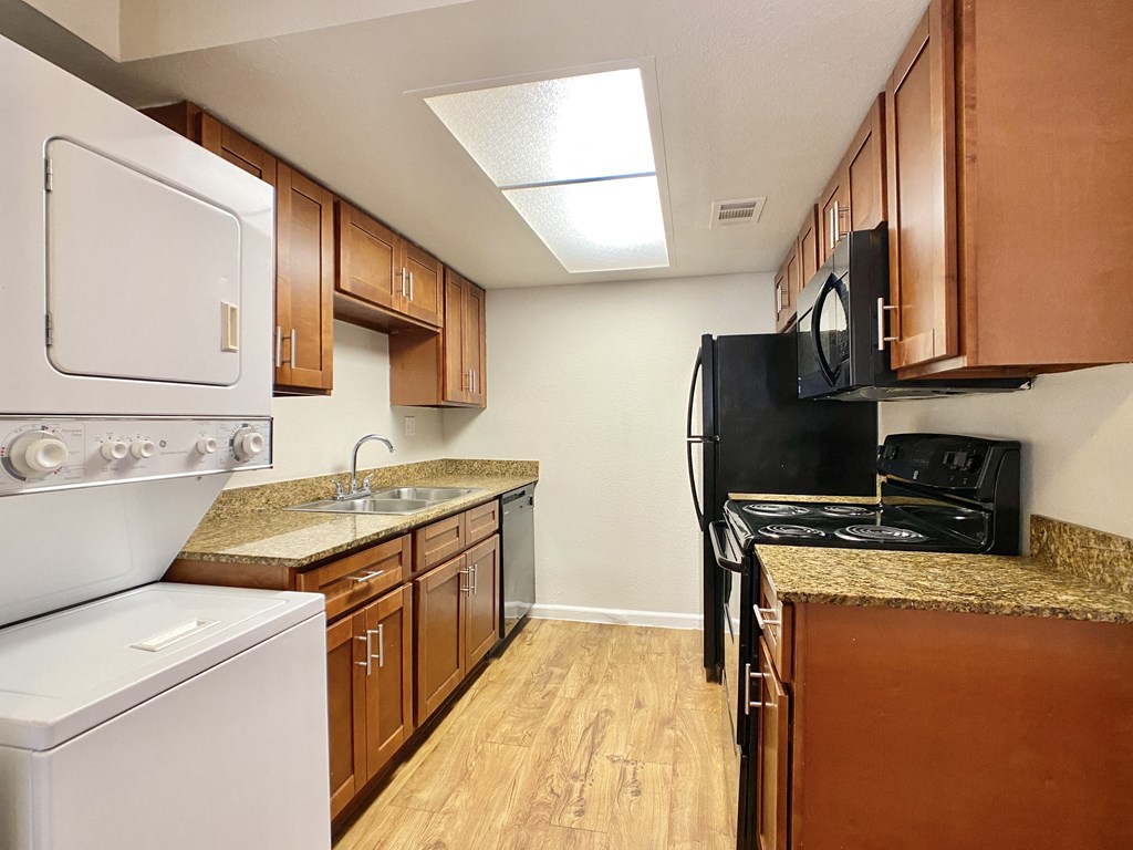 our apartments have a kitchen with a stove refrigerator and sink