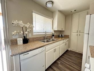 a kitchen with a sink and a dishwasher at Aspire Seneca, Victorville, 92392