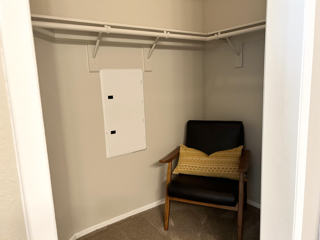 a chair in a large walk in closet at Riverton of the High Desert Apartments,Victorville, California