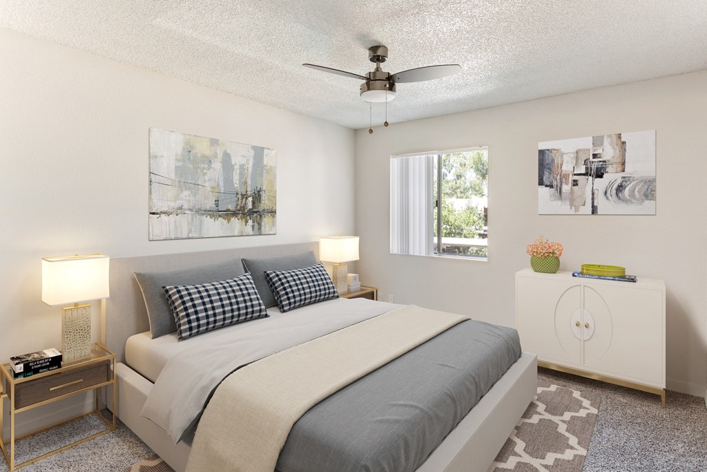 a bedroom with a bed and a ceiling fan