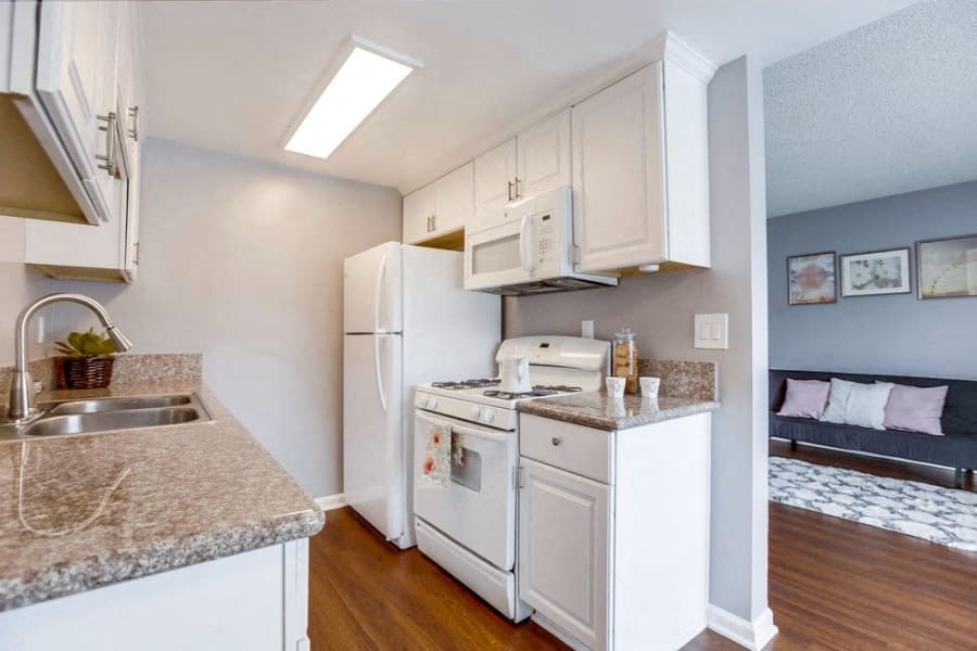 Hardwood Flooring, White Appliances, and Grey Walls at Tuscany Villas Apartments, West Covina, CA, 91791