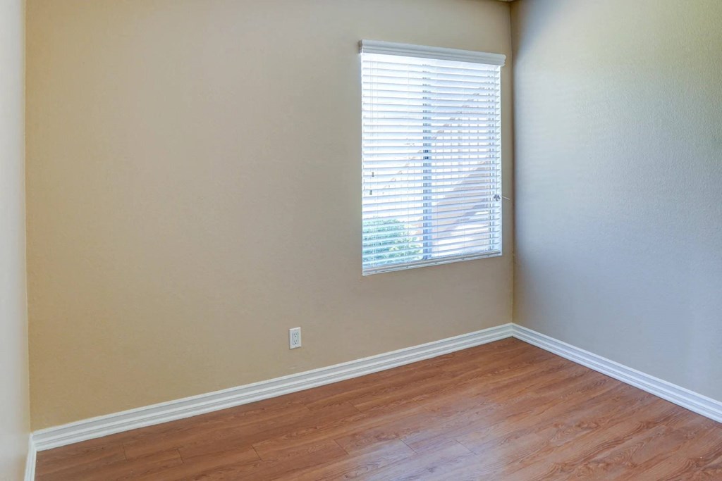 wooden floors and a window at The Arches at Regional Center West Apartments, California, 93551