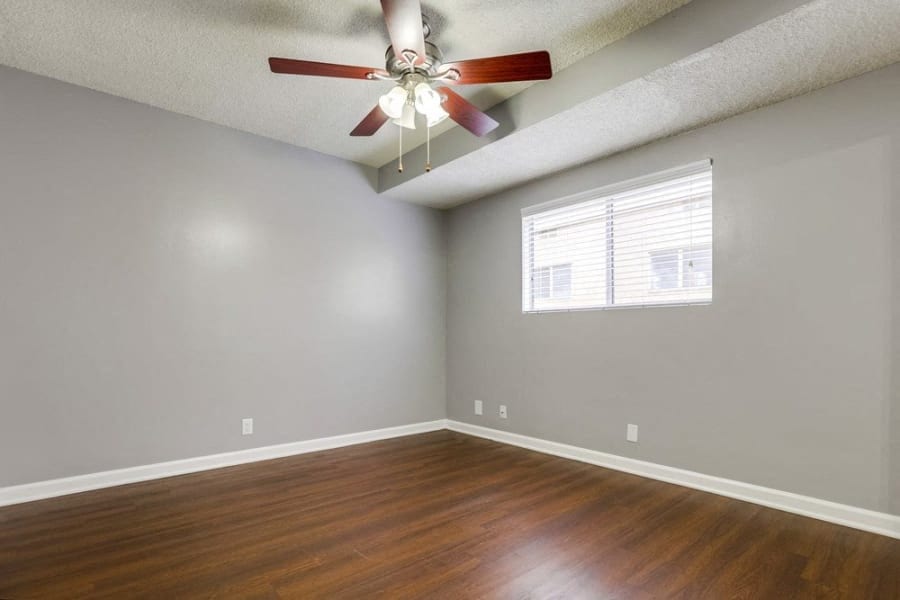 Ceiling Fan, Popcorn Ceiling, Grey Walls, and Access to Hallway at Tuscany Villas Apartments, California