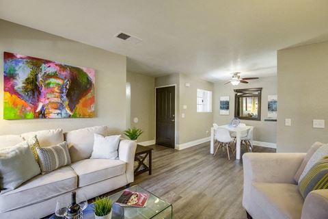 Vista Promenade Apartments in Temecula - Living Room with Stylish Decor, Hardwood Floor , Beige Walls and Cozy Fire Place