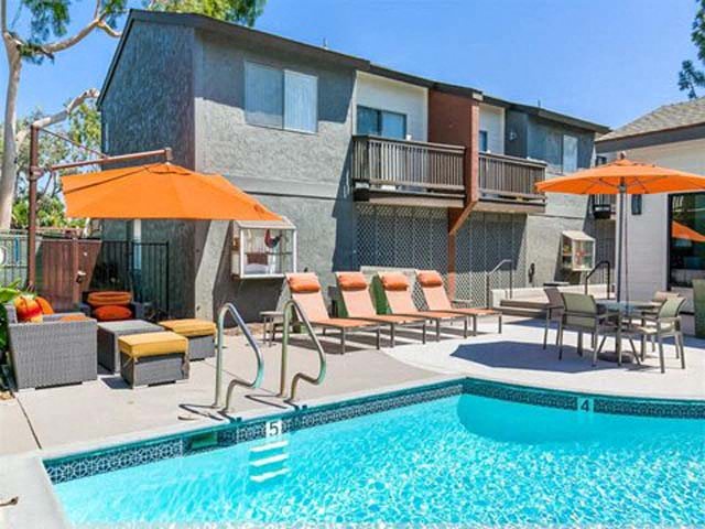 Ontario CA Apartments for Rent - Encore - Sparkling Pool Surrounded by Lounge Seating at Encore Apartments, California