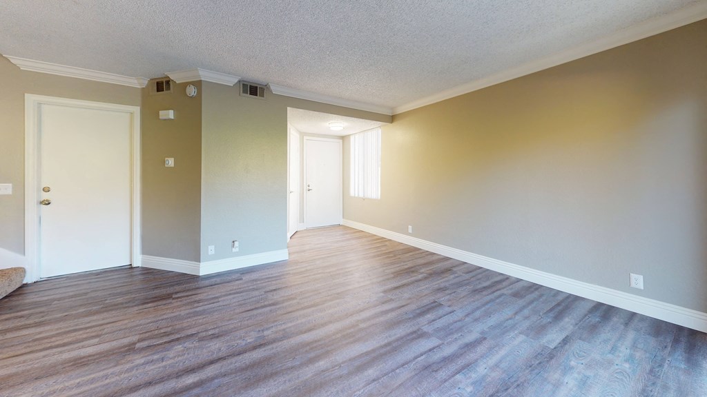 Pet Friendly Apartments in Ontario CA - Rancho Vista - Unfurnished Entryway With Wooden Floors, Stairs, and Doors Leading Outside at Rancho Vista Townhomes, California, 91764