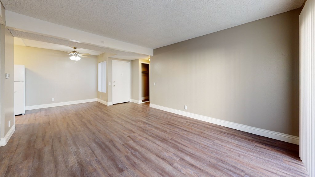 Living Room with Hardwood Flooring and Access to Dining Room at Avante Apartments, Ontario, CA, 91764