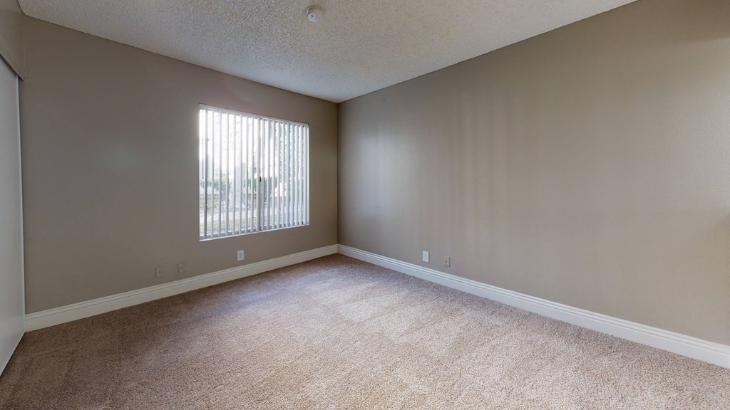 Bedroom with Wall to-Wall Carpet and A Large Window at Avante Apartments, California, 91764