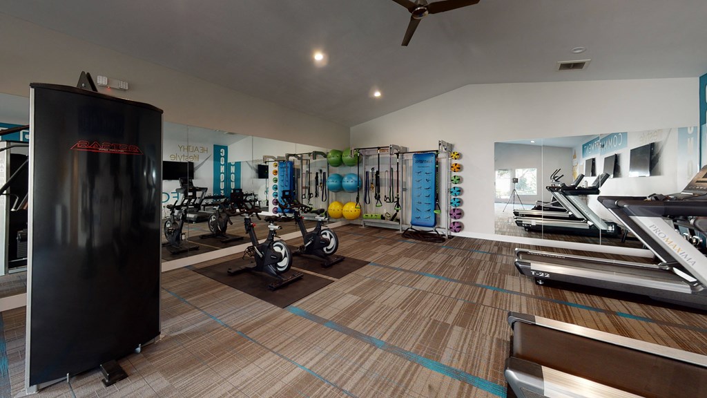 Fitness Center with Exercise Bikes, Treadmills, Free Weights, and More at Avante Apartments, California