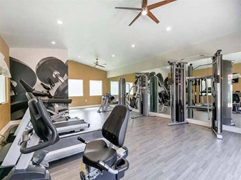 Apartments for Rent Ontario CA - Expansive Fitness Center Featuring Various Gym Equipment - Photo Gallery 4