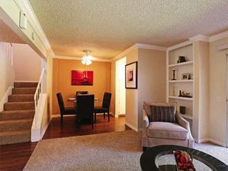 Ontario CA Apartments - Encore - Living Room with Half Wood-Style Flooring and Carpeted Stairs Toward Second Floor