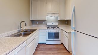 Two Bedroom Apartments in Ontario CA - Avante - White Kitchen with Grainte-Style Countertops
