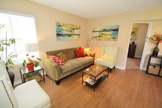 Antelope Valley CA Apartments - The Arches at Regional Center West - Living Room with Wood-Style Flooring