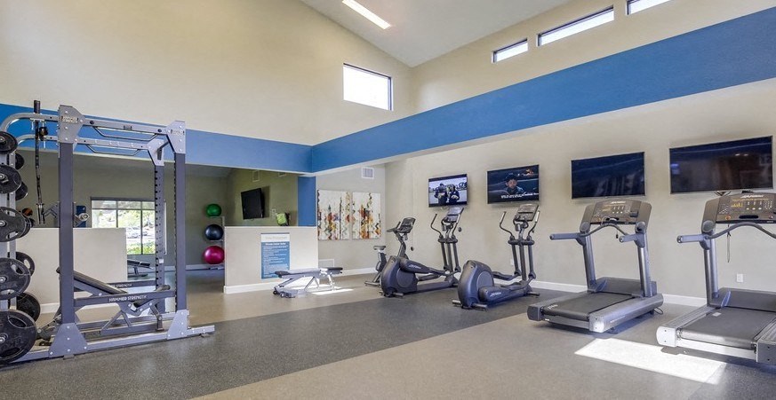 Fitness Center with treadmills, ellipticals, free weights, and more at Vista Promenade Apartments, Temecula, CA