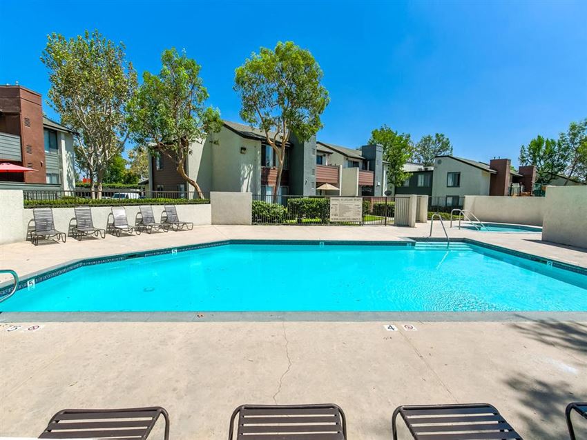Apartments in Ontario CA - Avante - Gated Pool Surrounded by Lounge Seating - Photo Gallery 1