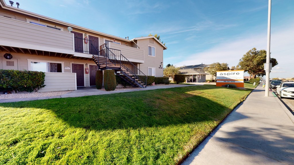 Exterior View of Apartment Building Surrounded By Lush Landscaping at Aspire High Desert Apartments, Victorville, 92392