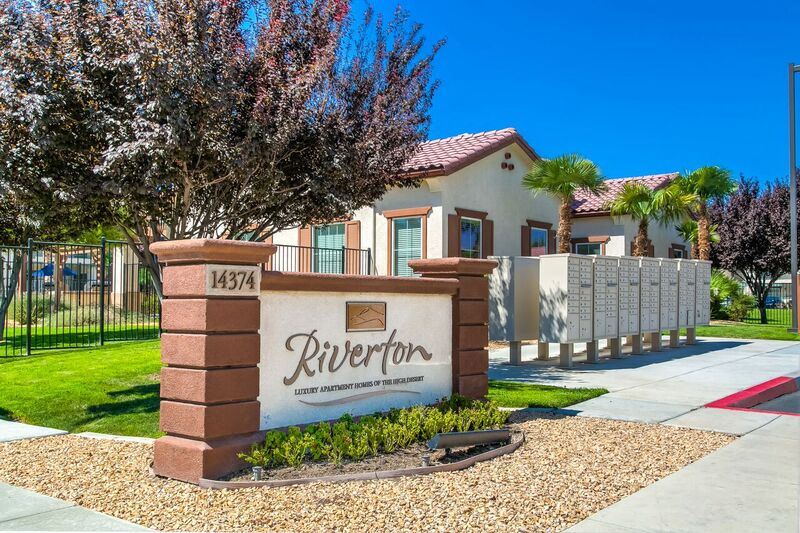 Apartments for Rent High Desert CA - Exterior View of Riverton of the High Desert's Building Showing Expansive Community and Green Landscaping - Photo Gallery 1