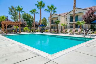 High Desert CA Apartments - Riverton of the High Desert - Gated Pool Surrounded by Lounge Seating - Photo Gallery