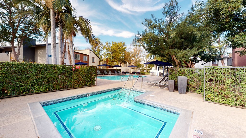 Gated Hot Tub and Pool Area with Outdoor Greenery and Poolside Seating at Avante Apartments, California, 91764