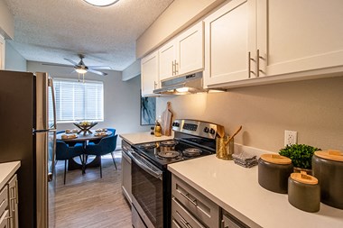 Kitchen with appliances near dining area 