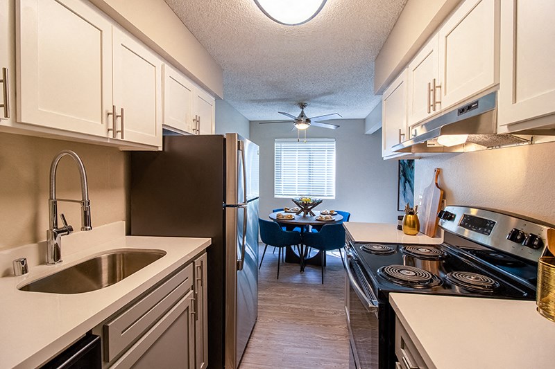 Kitchen with appliances near dining area