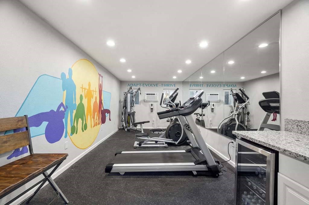 a gym with a colorful mural on the wall at Aspire Corona, Corona, CA