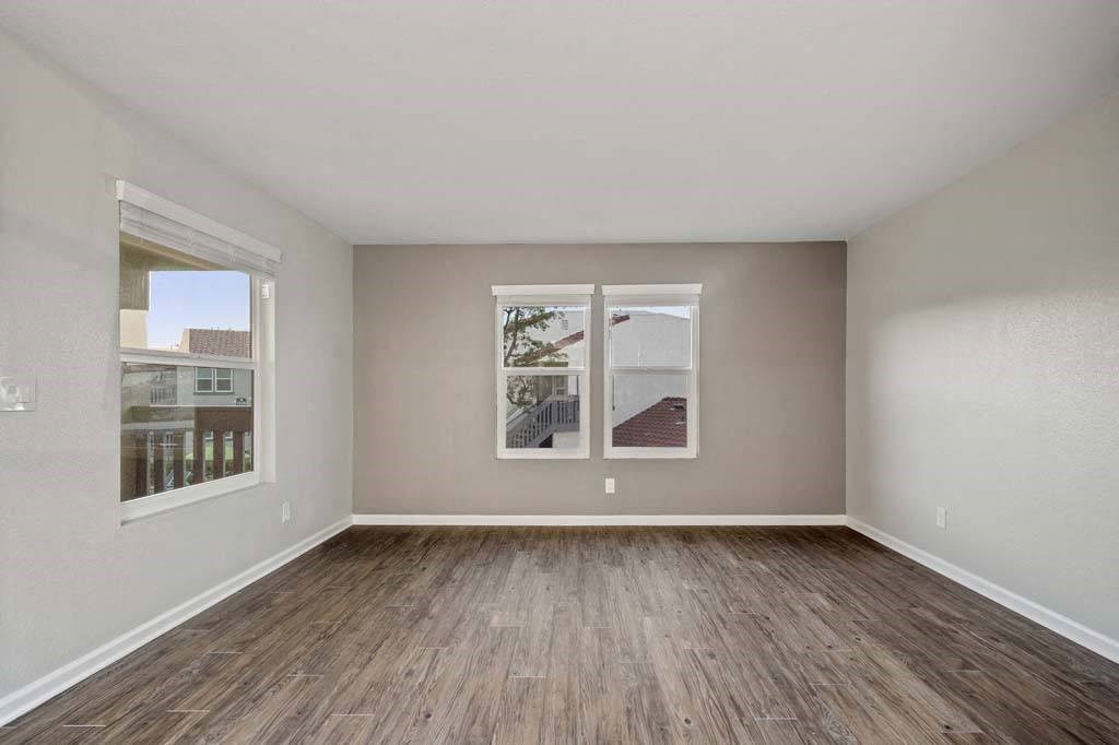 an empty room with two windows at Aspire Corona, Corona, CA 92882